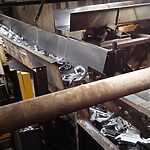 PRAB oscillating metal scrap conveyor system in operation