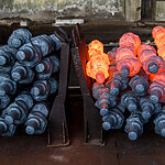 Hot cast iron parts on manufacturing production line