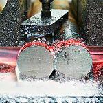 Metal machining cutting process generating chips during manufacturing operation